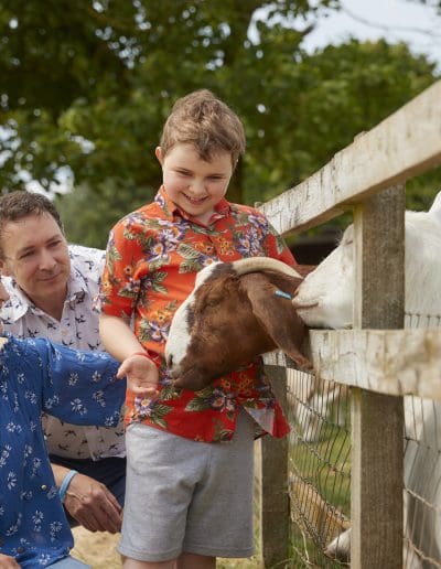 A family enjoying a visit to Cotswold Farm Park astor bannerman