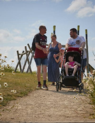 A family enjoying a visit to Cotswold Farm Park 7